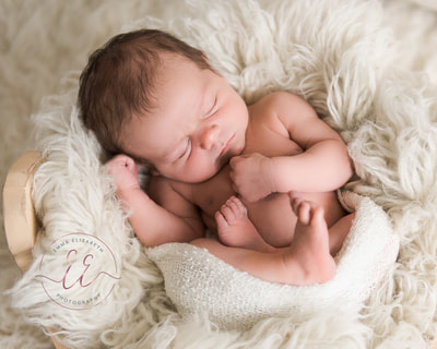 Professional newborn photography of a newborn baby. Newborn photography in St Neots, Huntingdon, Cambridgeshire