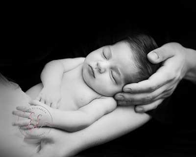 Black and white newborn posing. Newborn photography in St Neots, Huntingdon, Cambridgeshire