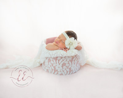 Newborn baby girl in a lace prop. Newborn photography in St Neots, Huntingdon, Cambridgeshire