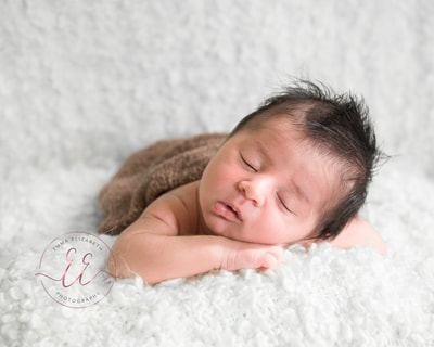 Iraqi baby boy professional newborn photo shoot. Newborn photography in St Neots, Huntingdon, Cambridgeshire