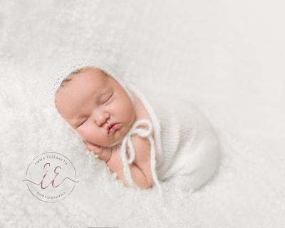 wrapped newborn baby. Newborn photography in St Neots, Huntingdon, Cambridgeshire