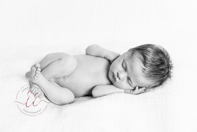 black and white newborn posing. Newborn photography in St Neots, Huntingdon, Cambridgeshire
